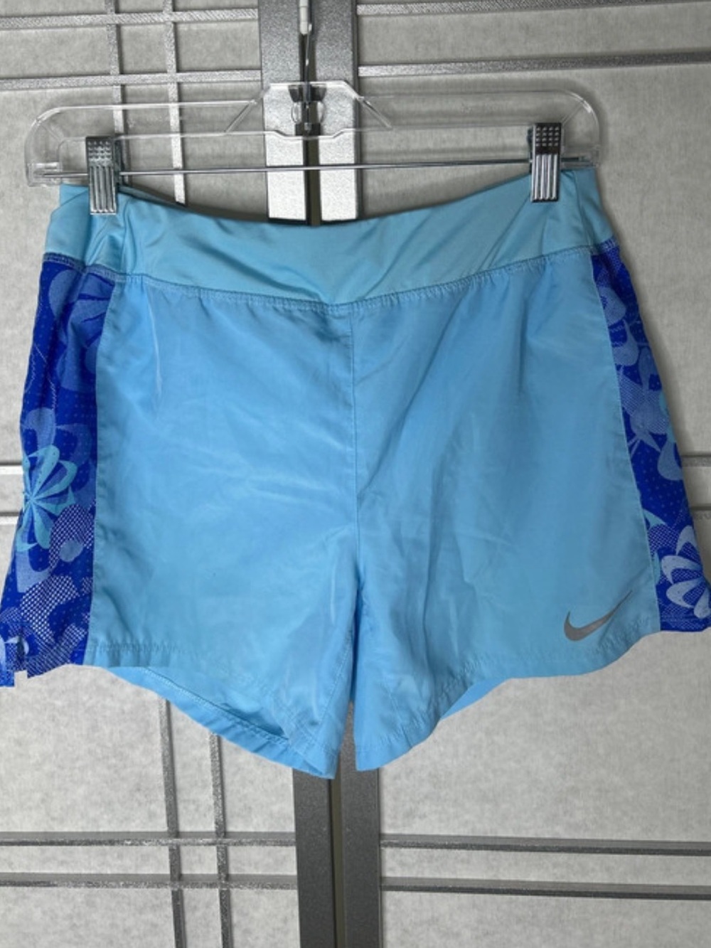 Nike girl’s Light Blue Athletic Shorts with Dark Blue Floral Panels